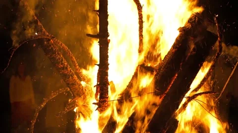 Fire burns prearranged branches Stock Footage 64840418