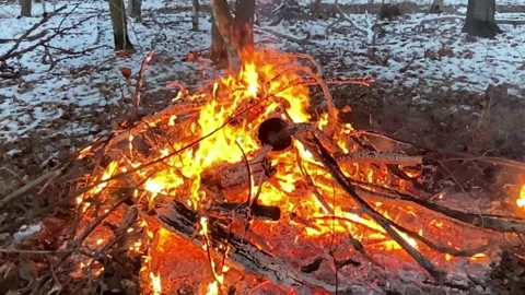 Fire burns slow motion, some snow behind Video stock 263843393