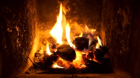 The fire burns in slowly in the fireplace Video stock 144629228