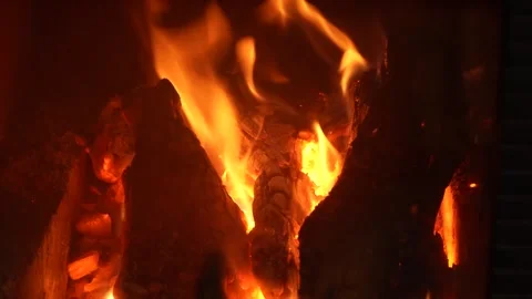 The fire burns slowly in the fireplace Stock Footage 303589438