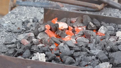 Fire burns in the smith's brazier, coal burns and smolders. Stock Footage 120260312