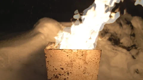 The fire burns in the tank in the wind at night Stock Footage 102033774