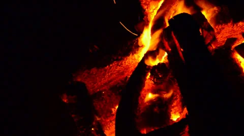 Fire of a campfire with falling wood billets Stock Footage 23569233
