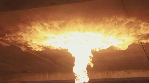 Fire on the ceiling from flamethrower at dark in slow motion. Stock Footage 83890640