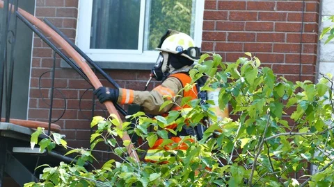 Fire Chief escalading stairs Stock Footage 114812161