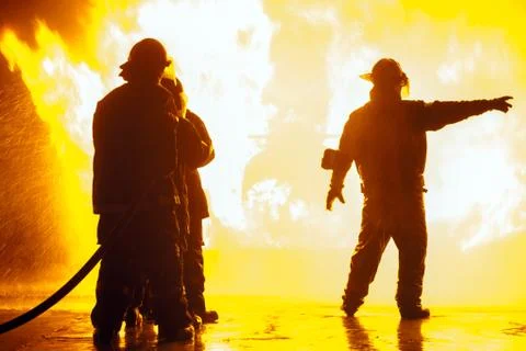 Fire chief pointing to the right during firefighting exercise Stock Photos