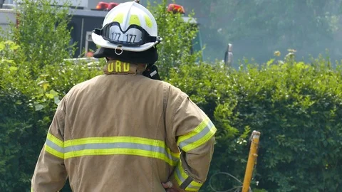 Fire Chief at structure fire scene Stock Footage 114769854