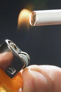 Fire to a cigarette Stock Photos