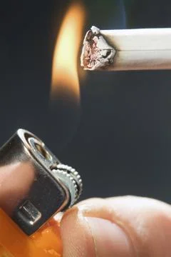 Fire to a cigarette Stock Photos