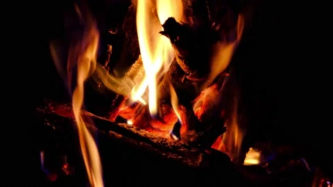 Fire close-up, burning logs in the fireplace a hot flame. Stock Footage 140220244