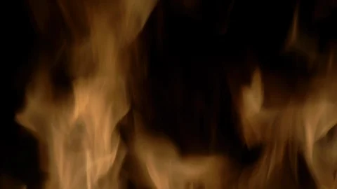 Fire. Close up of large flames, tilt down to burning leaves. No 1 Stock Footage 86647320