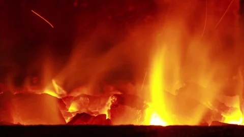 Fire of coal mine burning with sparks close up. Coal mine burning in fireplace Stock Footage 119712459