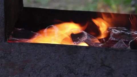 Fire, Coals for shish kebab are burning in the grill Stock Footage 85692126