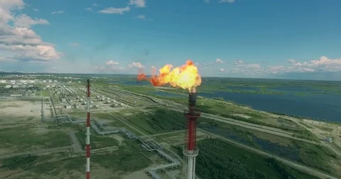 Fire is coming out of the pipe at the gas plant Stock Footage 75875152