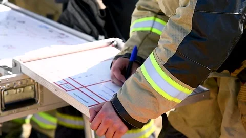 Fire commanders at the scene of a major fire, manage fire brigades Stock Footage 253666778