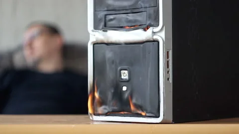 The fire of the computer system unit in the room where a man sleeps on the couch Stock-Footage 153795319
