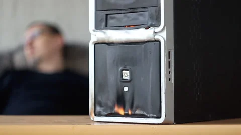 The fire of the computer system unit in the room where a man sleeps on the couch Stock Footage 153795520