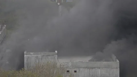 Fire at construction site in building of school under construction. Black smoke Stock Footage 155364449