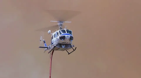 FIRE COPTER LANDS TO REFILL WATER Stock Footage 22997651