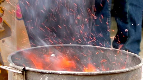 Fire crackers in trash fire Stock-Footage 66359465