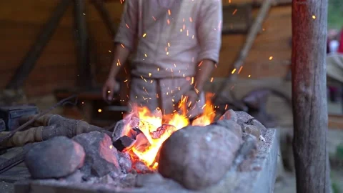 Fire crackling in blacksmith workshop of forging metal. Anonymouse craft smith Stock Footage 139626385
