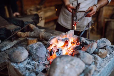 Fire crackling in blacksmith workshop of forging metal. Anonymouse craft smith Stock Photos