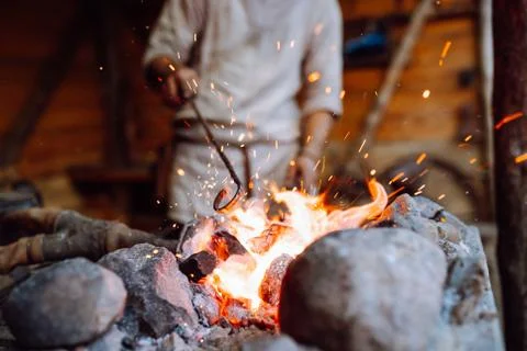Fire crackling in blacksmith workshop of forging metal. Anonymouse craft smith Stock-Fotos