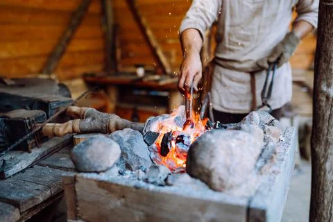 Fire crackling in blacksmith workshop of forging metal. Anonymouse craft smith Stock Photos