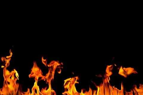 Fire creates infinity shapes when it burns. The orange from the flame and the Stock Photos