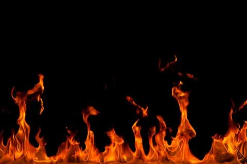 Fire creates infinity shapes when it burns. The orange from the flame and the Stock Photos