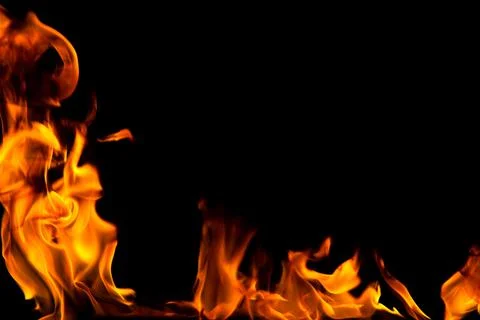 Fire creates infinity shapes when it burns. The orange from the flame and the Stock Photos