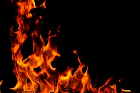 Fire creates infinity shapes when it burns. The orange from the flame and the Stock Photos