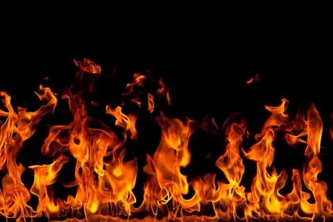 Fire creates infinity shapes when it burns. The orange from the flame and the Stock Photos