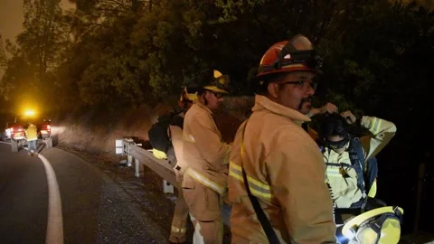 Fire Crew fighting fire Stock Footage 296364146