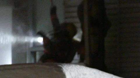 Fire crews piercing ceiling structure in attempt to extinguish fire at night Stock Footage 104509776