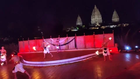 Fire dance performance with the backdrop of Prambanan Temple, Yogyakarta Stock Footage 255293263