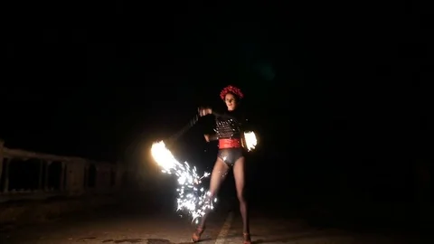 The fire dance show at a party held by the sea. women and men play fire show Stock Footage 71546783