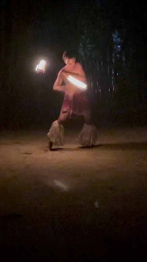 A fire dancer in Fiji performing at night with flaming torches Stock Footage 313278175