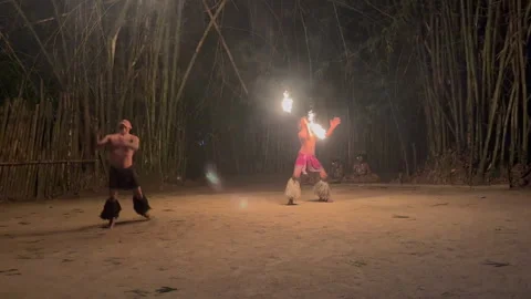 A fire dancer in Fiji performing at night with flaming torches Stock Footage 313278731