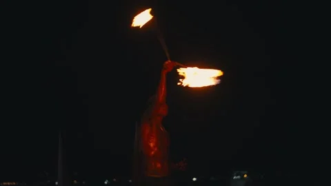 Fire dancer performing with torches on Koh Tao beach at night in Asia Stock Footage 335897769