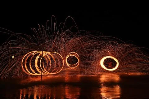 Fire dancer swing fire dancing show  Stock Photos