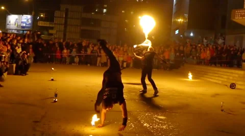 Fire dancers make tricks and flips with fire Stock Footage 62879766