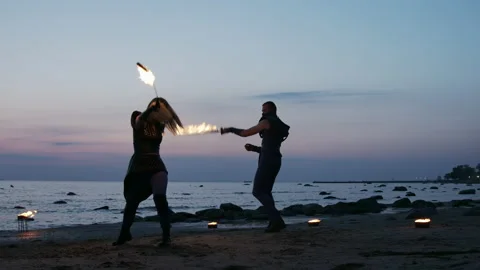 Fire dancers performing and juggling with fire Stock Footage 144680711