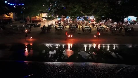 Fire dancers performing on beach at night in thailand Video stock 305637715