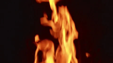 Fire dances in four frames capturing its movement and energy in a dark space Stock Footage 342368960