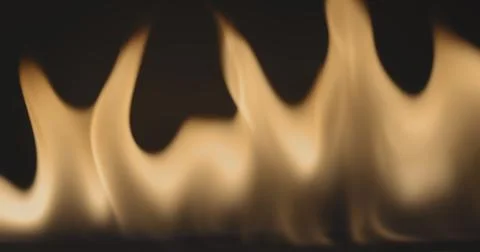 Fire dancing against dark background 120fps slow motion loopable footage Foto stock
