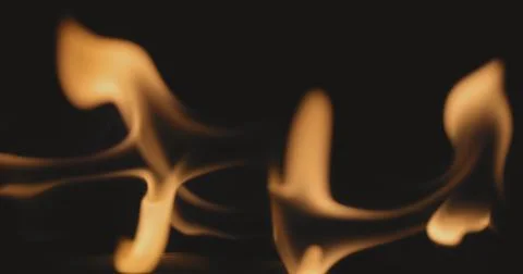 Fire dancing against dark background 120fps slow motion loopable footage Foto stock