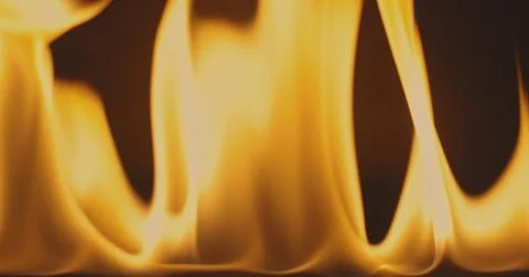 Fire dancing against dark background 120fps slow motion loopable footage Foto stock