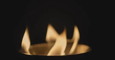 Fire dancing against dark background 120fps slow motion loopable footage Foto stock