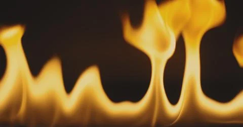 Fire dancing against dark background 120fps slow motion loopable footage Foto stock